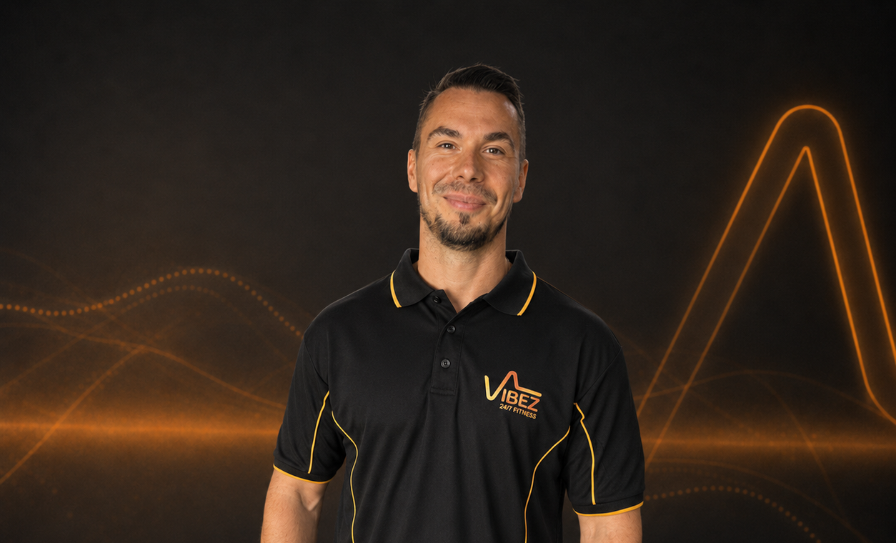 Vibez fitness trainer smiling confidently | VibeZ 24/7 Fitness